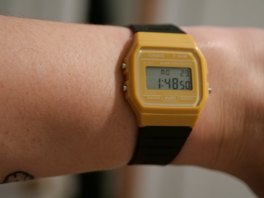 a shot of a yellow and black assembled sensor watch, on the author's wrist